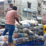 উদ্ধার করা পণ্যগুলো নিয়ে যাচ্ছেন মালিকরা