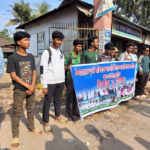 নেত্রকোনা – ১ আসনে প্রার্থীতা বাতিল ও গ্রেফতারের দাবিতে মানববন্ধন